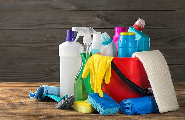 Variety House Cleaning Product On Wood Table Close Up